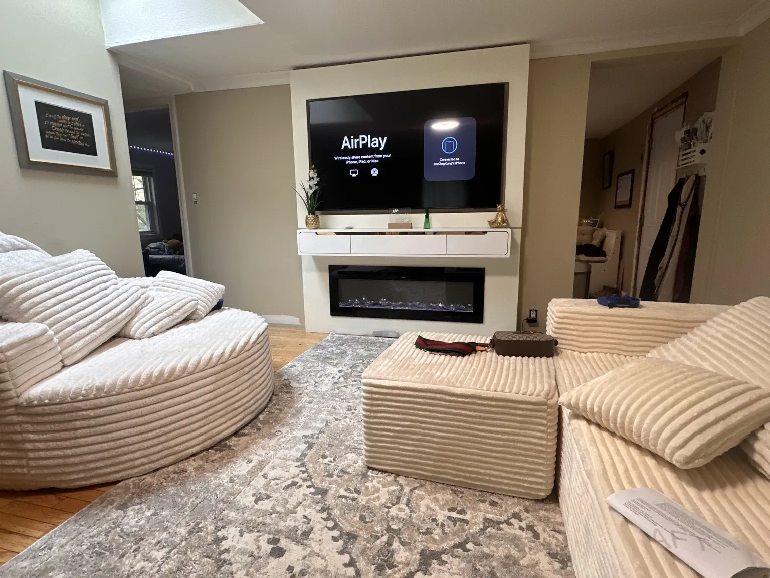 Completed television integration above a fireplace